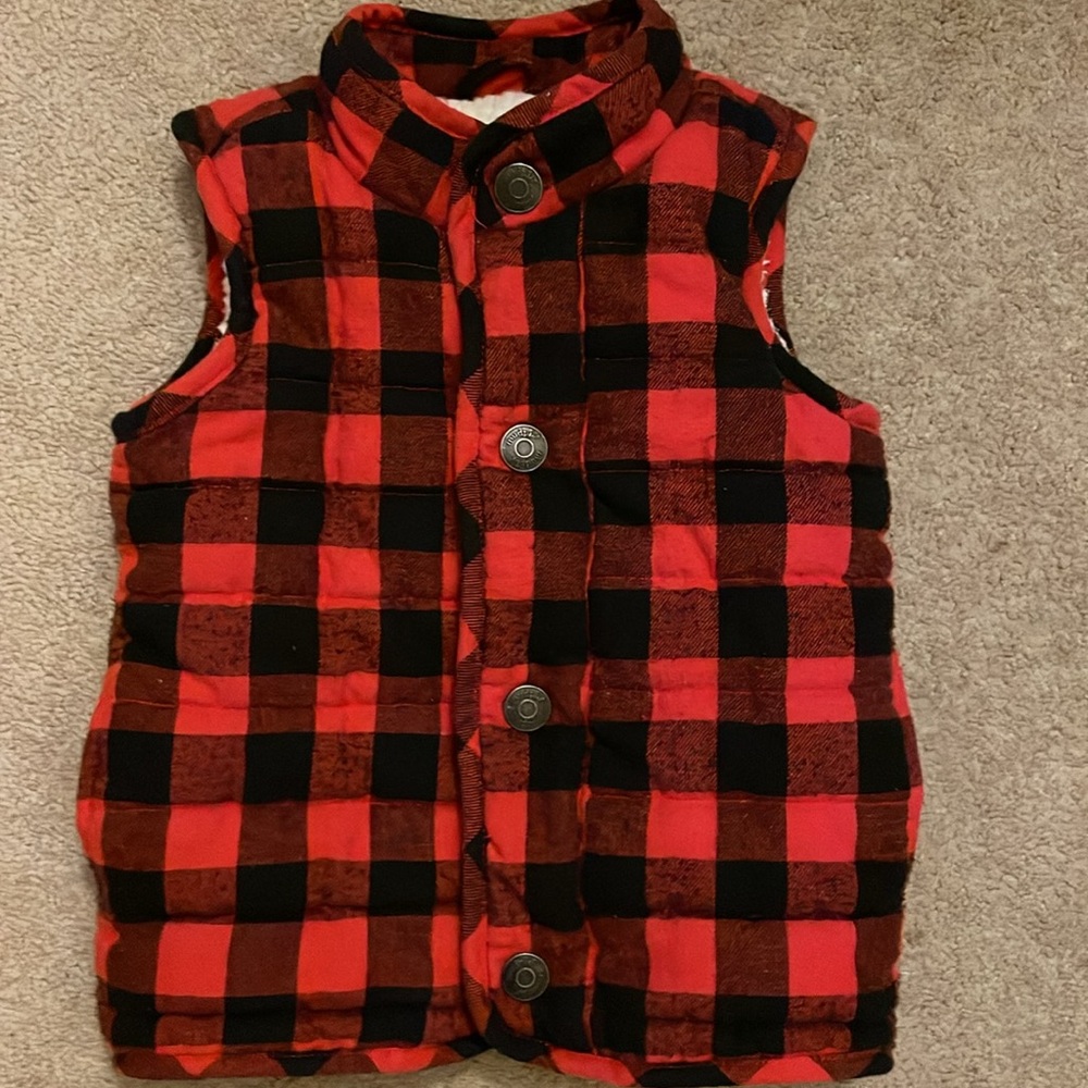 Flannel, fleece lined button up vest. Toddler size 2T-3T. Excellent condition.